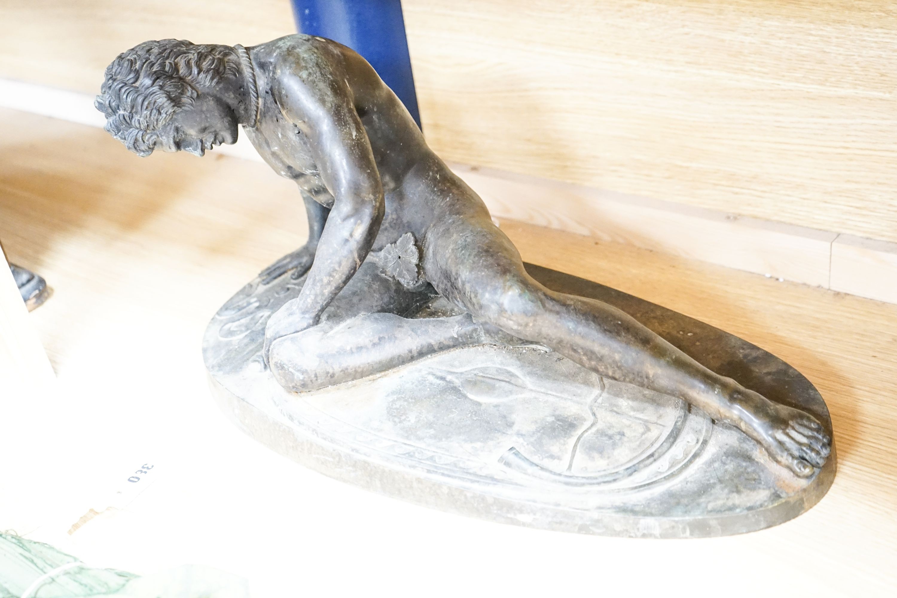 After the Antique, A late 19th/early 20th century bronze group ‘The Dying Gaul’ 55cm